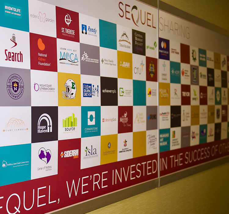 SeQuel Sharing wall with various tiles containing brands
